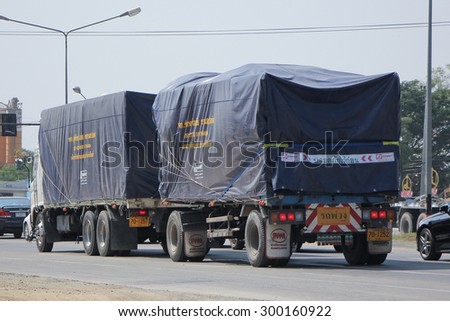CHIANGMAI , THAILAND- FEBRUARY 5 2015:  Cargo Trailer truck of Rungthip Asia Transport Company. Photo at road no 121 about 8 km from downtown Chiangmai, thailand.