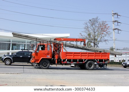 CHIANGMAI , THAILAND- FEBRUARY 5 2015:  Private Truck with crane for transportation of electricity post. Photo at road no 121 about 8 km from downtown Chiangmai, thailand.