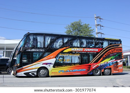 CHIANGMAI , THAILAND -JANUARY 11 2015: Travel bus of Manus Junpetch Travel Company. Photo at road no.1001 about 8 km from downtown Chiangmai, thailand.