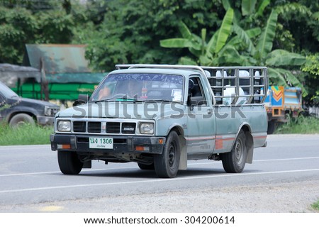 CHIANGMAI , THAILAND - AUGUST 6 2015:  Drinking water delivery Pickup truck of Sahagorn company. Photo at road no.121 about 8 km from downtown Chiangmai, thailand.
