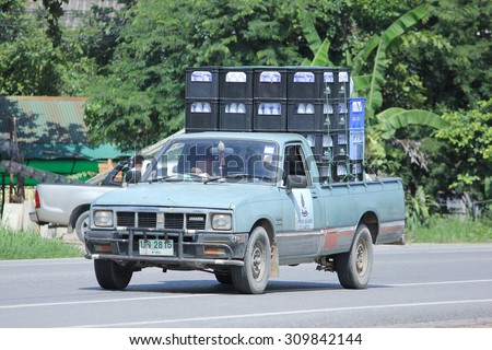 CHIANGMAI, THAILAND -AUGUST 10 2015:  Drinking water delivery truck of Nam Nueng company. Photo at road no.1001 about 8 km from downtown Chiangmai, thailand.