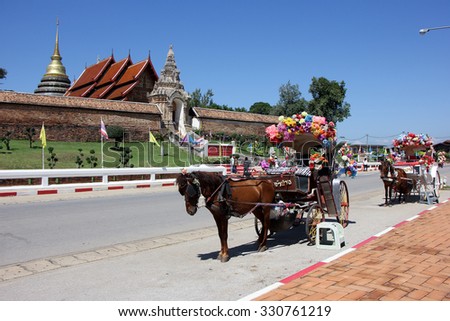 LAMPANG, THAILAND -OCTOBER  21 2015: Horse carriage at Wat pra that Lampang Luang. Lanna style Buddhist temple in Lampang Province, Thailand.