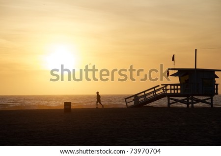 Beach Runner at Sunset in Santa Monica, California.