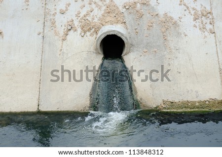 Irrigation canal and drainage waste water pipe in town.