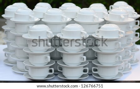 Stacked empty tea or coffee cup prepared for dinner.