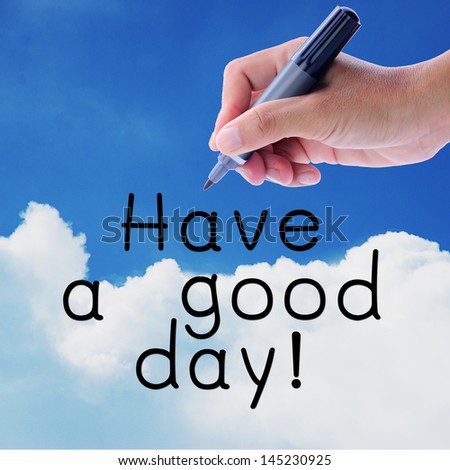 Man hand writing word, Have a good day, on on sky and cloud.