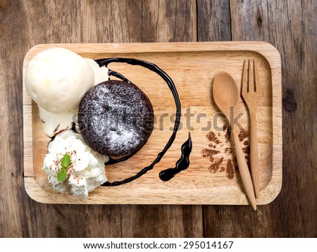 Top view Chocolate cake and ice cream on wood table background
