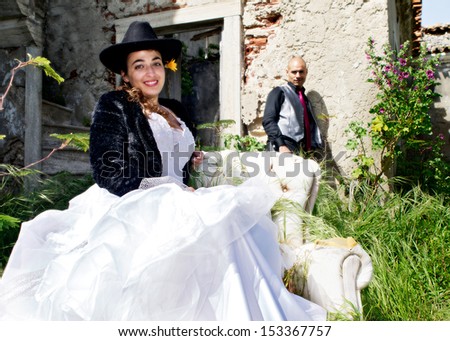 Bride and groom performing in a different wedding scene