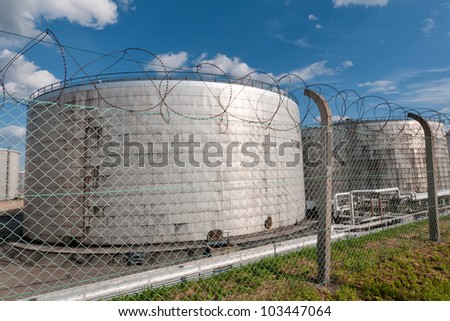 The storage tanks at an oil refinery complex