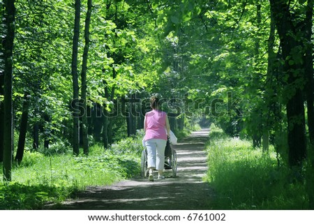 Man Pushing Wheelchair