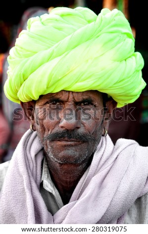 PUSHKAR, INDIA - MARCH 03, 2013: Undefined Indian man with mustache and colourful turban portrait Pushkar, India. March 3, 2013