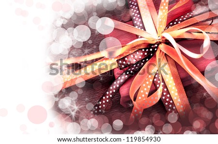 Holidays background/ Holidays present with bow from atlas ribbon/ Romantic valentin days gift