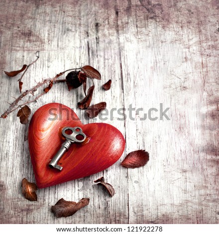 Key with the heart as a symbol of love vintage card with red heart on grunge old background valentin es day background Key with the heart as a symbol of love vintage card with red heart on grunge old background valentin es day background