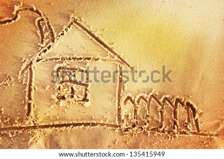 Beach sand background with a house/sunny beach background with a sand/House drawn in the sand