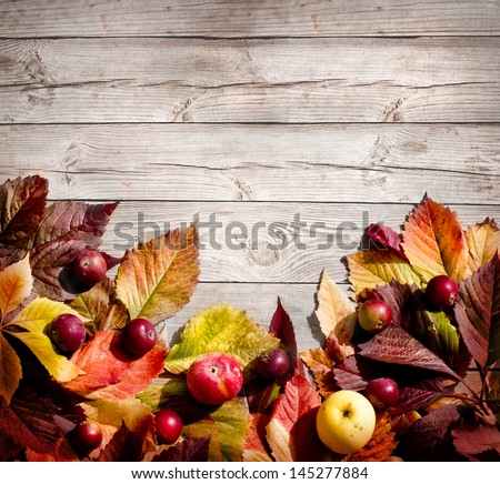 Vintage Autumn Border From Apples And Fallen Leaves On Old Wooden Table/Thanksgiving Day Concept/Background With Apples