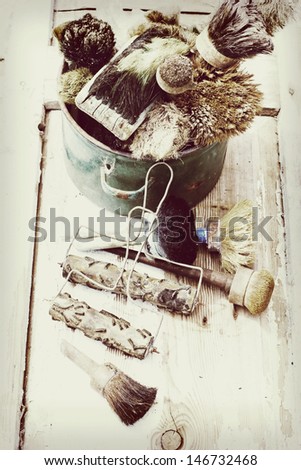 Set of old brush for coloring the walls/  Brush painting wooden furniture, close up/Paintbrush on wood background