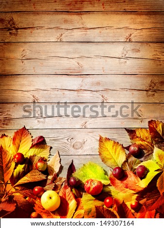 Vintage Autumn Border From Apples And Fallen Leaves On Old Wooden Table/Thanksgiving Day Concept/Background With Apples