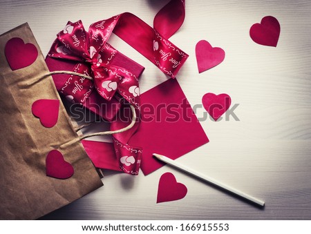 Valentines Day gift, hearts and greeting card on wooden plates in vintage style/ Valentines day background