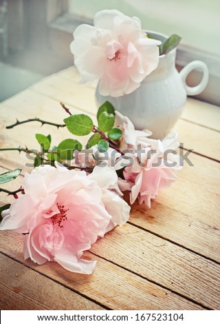White roses in a vase in vintage style/ Valentines day background