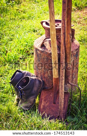 Gardening tools in spring time/ rustic background with old garden tools