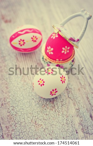 Retro still life with eggs  over textured vintage background/ Easter background