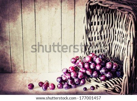 assortment of ripe sweet grapes in basket on texture background/Grapes in the basket/ Summer Wine Season