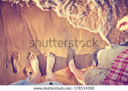 Vacation holidays.Feet closeup of relaxing on beach in sunny summer day.