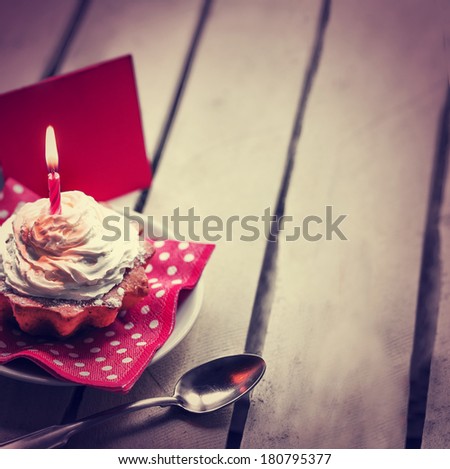 Holidays background with Birthday cupcake/ Birthday greeting card with cupcake and candle