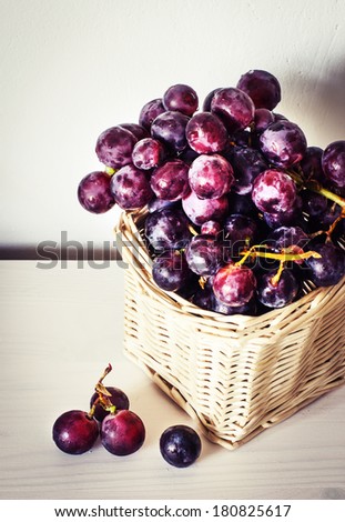 assortment of ripe sweet grapes in basket wooden background/Grapes in the basket/ Summer Wine Season