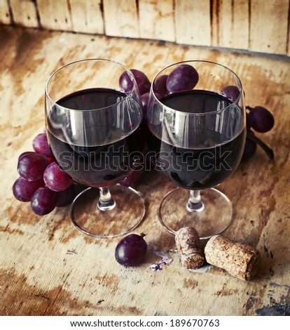 Red wine and grapes in vintage setting