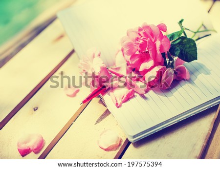Beautiful roses on desk wooden background/holidays romantic background