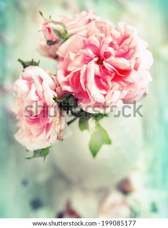Beautiful roses on desk wooden background/holidays romantic background