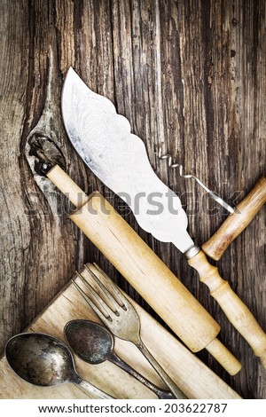 Vintage cutlery on rustic wooden background/ Vintage Kitchen Utensils for cooking