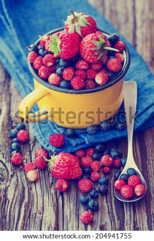 Berries on Wooden Background. Summer or Spring Organic Berry over Wood. Agriculture, Gardening, Harvest Concept