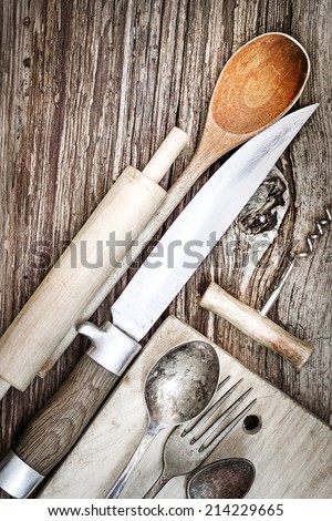 Vintage cutlery on rustic wooden background/ Vintage Kitchen Utensils for cooking