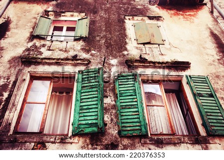 Old town in Europe / old dirty windows on old dirty wall