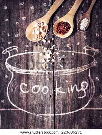 Rural vintage wood kitchen table with drawing bowl and spices for cooking/ cooking idea concept