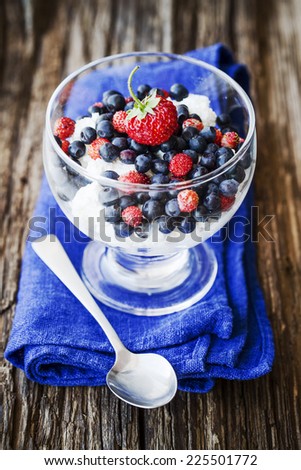 Berry dessert /Sweet dessert with berry and cottage cheese  in glass jar, selective focus