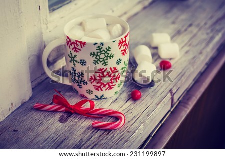 Winter cozy background with Marshmallow in the Cup of coffee.Cozy sweet Christmas background