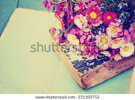 Vintage Albums with Photos of Memories with bouquet of flowers/ nostalgic vintage background