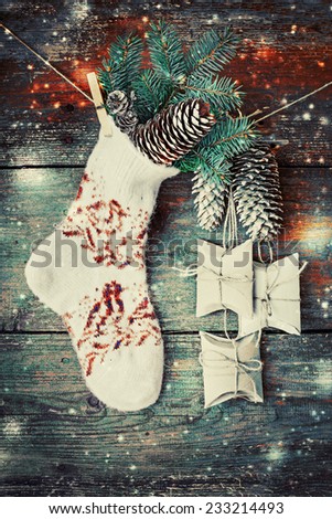 christmas composition with socks, present boses fir and fir-cone on wooden background/ Christmas card with christmas rustic decorations