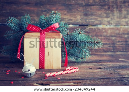 Christmas present on dark wooden background in vintage style