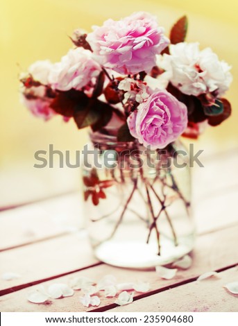 Beautiful roses in a vase in vintage style/ Gentle flower  background