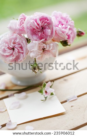 Beautiful roses in a vase in vintage style/ Gentle flower  background
