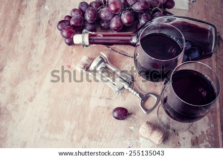 Red wine and grapes in vintage setting