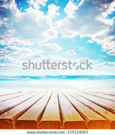 wooden retro deck and blue sky and sea/ Summer holidays background