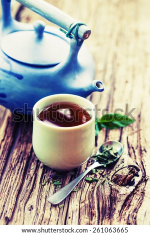 Set of China tea/ Chinese style herbal floral tea over wood table with raw ingredients