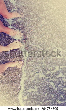 Vacation holidays.Feet closeup of relaxing on beach/ Summer holidays background
