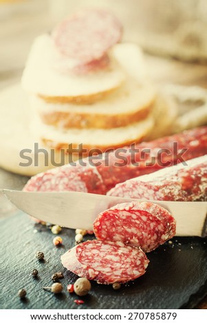 Italian salami/ salami on wooden background
