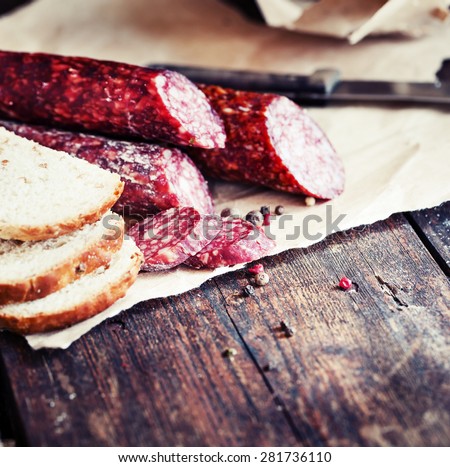 Italian salami/ salami on wooden background